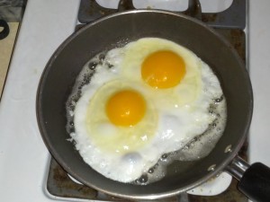 H and H Feed eggs in a pan